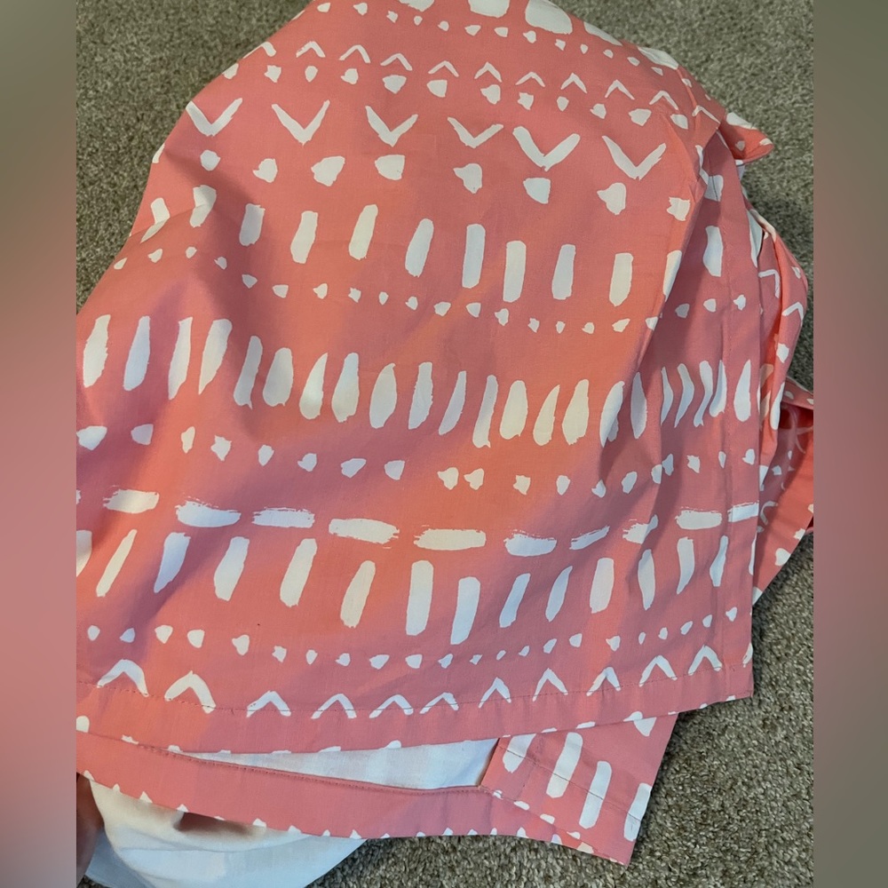 Crate&barrel crib skit. Cute pink color on tribal pattern.